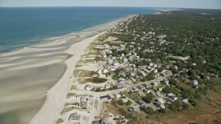 5.5K aerial stock footage flying over sand bars, approach small coastal town, Cape Cod, Dennis, Massachusetts Aerial Stock Footage | AX143_151E