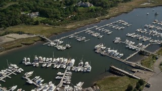 AX143_163E - 5.5K aerial stock footage approaching Jesuit Harbor, marina, Cape Cod, Dennis, Massachusetts