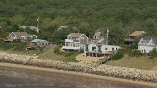 5.5K aerial stock footage flying by raised beachfront homes, Cape Cod, Eastham, Massachusetts Aerial Stock Footage | AX143_185