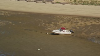 5.5K aerial stock footage flying by beached fishing boat on sandbar, Cape Cod, Eastham, Massachusetts Aerial Stock Footage | AX143_187