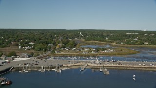 5.5K aerial stock footage flying over Chipman's Cove, approach Wellfleet Town Pier, Wellfleet, Massachusetts Aerial Stock Footage | AX143_195E