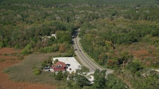 5.5K aerial stock footage panning right by Highway 6 through forest, Wellfleet, Massachusetts Aerial Stock Footage | AX143_199E