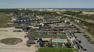 AX143_219 - 5.5K aerial stock footage flying by Kalmar Village, Sandcastle Resort, Truro, Massachusetts