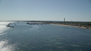 5.5K aerial stock footage approaching piers, small coastal town, Provincetown, Massachusetts Aerial Stock Footage | AX143_221