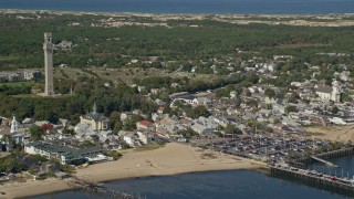 AX143_235 - 5.5K aerial stock footage orbiting Pilgrim Monument, Provincetown City Hall, Provincetown, Massachusetts