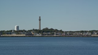 5.5K aerial stock footage orbiting sailing boat, revealing Pilgrim Monument and Provincetown, Massachusetts Aerial Stock Footage | AX143_244E