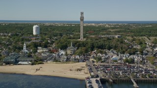 5.5K aerial stock footage approaching Pilgrim Monument, Provincetown Town Hall, Provincetown, Massachusetts Aerial Stock Footage | AX143_248E