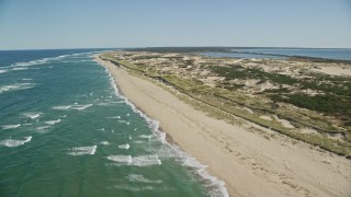 5.5K aerial stock footage flying by the beach, Cape Cod, Provincetown, Massachusetts Aerial Stock Footage | AX144_007E