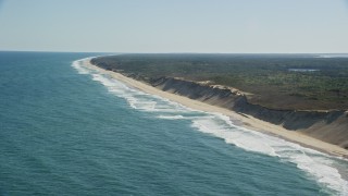 AX144_021E - 5.5K aerial stock footage flying by crashing waves, beaches, Cape Cod, Truro, Massachusetts