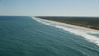 5.5K aerial stock footage flying by waves rolling onto beaches, Cape Cod, Wellfleet, Massachusetts Aerial Stock Footage | AX144_027E