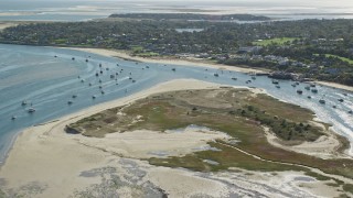 AX144_045E - 5.5K aerial stock footage flying over Strong Island, approaching small coastal town, Chatham, Massachusetts