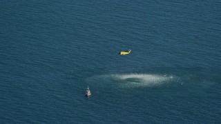 5.5K aerial stock footage flying by Coast Guard helicopter, rescue practice, Atlantic Ocean Aerial Stock Footage | AX144_068E