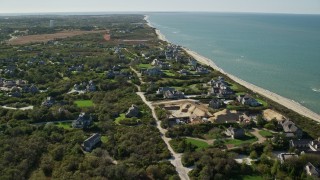 AX144_104E - 5.5K aerial stock footage flying over small coastal community, upscale homes, Nantucket, Massachusetts