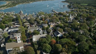 AX144_137E - 5.5K aerial stock footage orbiting small coastal town, Edgartown, Martha's Vineyard, Massachusetts