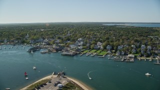 AX144_141 - 5.5K aerial stock footage orbiting small coastal town, piers, Edgartown, Martha's Vineyard, Massachusetts