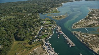 AX144_160 - 5.5K aerial stock footage flying by Menemsha Pond, Chilmark, Martha's Vineyard, Massachusetts