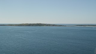 5.5K aerial stock footage approaching a coastal community, Cuttyhunk Island, Elisabeth Islands, Massachusetts Aerial Stock Footage | AX144_168E