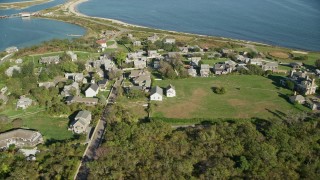 5.5K aerial stock footage orbiting coastal community, Cuttyhunk Island, Elisabeth Islands, Massachusetts Aerial Stock Footage | AX144_175