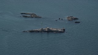 AX144_183 - 6k aerial stock footage flying by lighthouse, Dumpling Rocks, Dumpling Rocks Light, Massachusetts