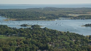 AX144_207E - 6k aerial stock footage flying by Apponagansett Bay, Dartmouth, Massachusetts