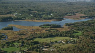 6k aerial stock footage flying by river and marshland, Westport, Massachusetts Aerial Stock Footage | AX144_215