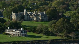 AX144_256 - 6k aerial stock footage flying by Carey Mansion, Seaview Terrace, Newport, Rhode Island