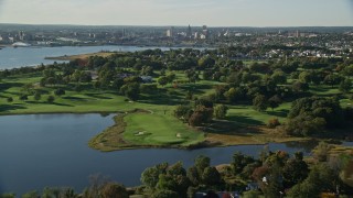 AX145_027E - 6k aerial stock footage video approaching, flying over suburban neighborhood, East Providence, Rhode Island