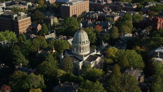 AX145_068 - 6k aerial stock footage orbiting First Church of Christ Scientist, trees, Providence, Rhode Island