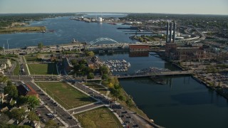 6k aerial stock footage approaching Providence River Bridge, factories, Providence, Rhode Island Aerial Stock Footage | AX145_069