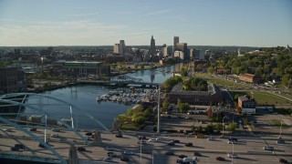 AX145_082E - 6k aerial stock footage approaching the Providence River Bridge, Downtown Providence, Rhode Island