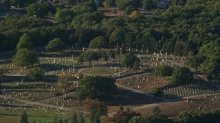 6k aerial stock footage flying by a cemetery, green trees, Providence, Rhode Island Aerial Stock Footage | AX145_092