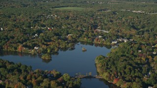 6k aerial stock footage approaching, flying over Lake Hiawatha, autumn, North Attleborough, Massachusetts Aerial Stock Footage | AX145_101E