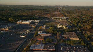 6k aerial stock footage flying by office buildings, warehouses, autumn, Westwood, Massachusetts, sunset Aerial Stock Footage | AX146_001E