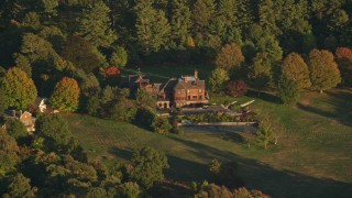 6k aerial stock footage flying by isolated mansion, autumn, Westwood, Massachusetts, sunset Aerial Stock Footage | AX146_005