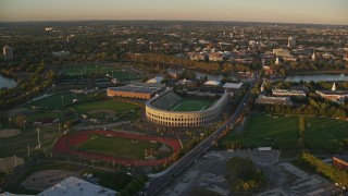 6k aerial stock footage flying by Harvard Stadium, McCurdy Track, Harvard University, Massachusetts, sunset Aerial Stock Footage | AX146_040