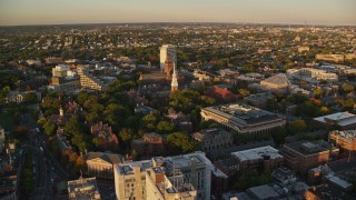 AX146_044E - 6k aerial stock footage approaching Memorial Church, Harvard University, Massachusetts, sunset