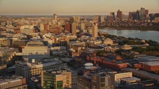 AX146_048E - 6k aerial stock footage flying by Massachusetts Institute of Technology, Cambridge, Massachusetts, sunset