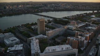 AX146_055 - 6k aerial stock footage panning right by Massachusetts Institute of Technology, Massachusetts, sunset