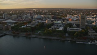 AX146_056E - 6k aerial stock footage flying by Massachusetts Institute of Technology, Massachusetts, sunset