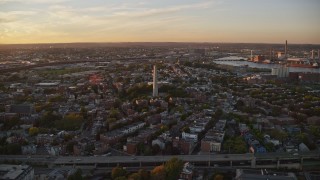 6k aerial stock footage flying by row house, Bunker Hill Monument, Charlestown, Massachusetts, sunset Aerial Stock Footage | AX146_073E