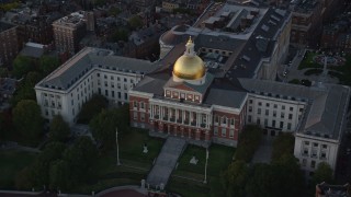 6k aerial stock footage approaching Massachusetts State House, Downtown Boston, Massachusetts, sunset Aerial Stock Footage | AX146_086