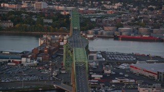 AX146_089 - 6k aerial stock footage flying by the Tobin Memorial Bridge, Charlestown, Massachusetts, sunset