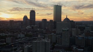 6k aerial stock footage flying by downtown skyscrapers, Downtown Boston, Massachusetts, sunset Aerial Stock Footage | AX146_113E