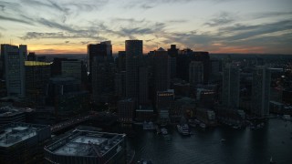 6k aerial stock footage flying by the skyline, Downtown Boston, Massachusetts, twilight Aerial Stock Footage | AX146_136