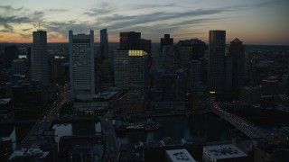 6k aerial stock footage flying over skyscrapers, tilting down, Downtown Boston, Massachusetts, twilight Aerial Stock Footage | AX146_138E