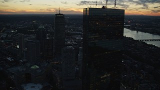 AX146_144E - 6k aerial stock footage Back Bay row houses and skyscrapers, Downtown Boston, Massachusetts, twilight