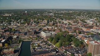 6K aerial stock footage flying over canal, warehouses and office buildings, Salem, Massachusetts Aerial Stock Footage | AX147_036E