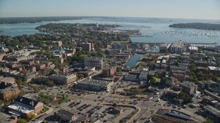 AX147_048E - 6K aerial stock footage flying over coastal town toward harbor, Salem, Massachusetts