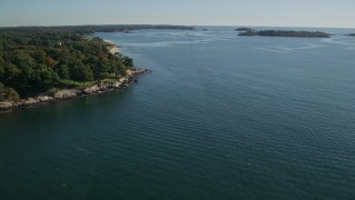 AX147_056 - 6K aerial stock footage flying over Salem Sound along coastline, Beverly, Massachusetts