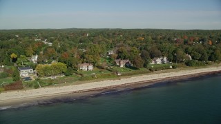 6K aerial stock footage flying by beachfront mansions and fall foliage, autumn, Beverly, Massachusetts Aerial Stock Footage | AX147_057E